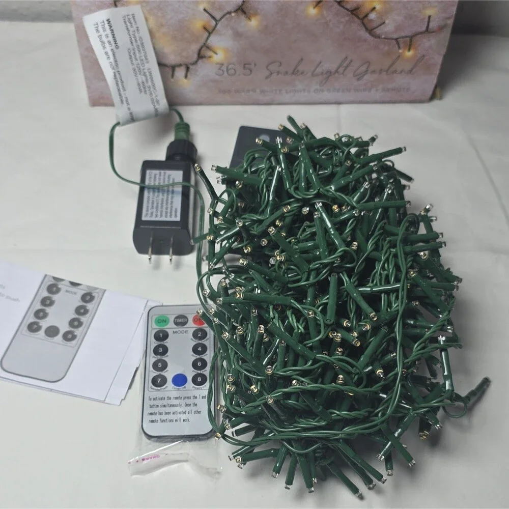 RAZ Imports 36.5' Snake Light Garland 500 Warm White LED, Remote, Green Cord